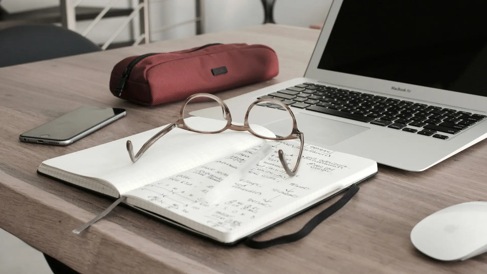 photo of computer and notebook for financial planning