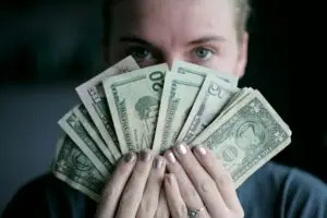 photo of person holding up money