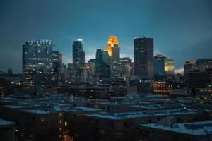 Captivating night skyline of Minneapolis showcasing illuminated skyscrapers and urban architecture.